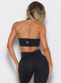 back profile view of a model wearing the Rib Backless Bra in black color