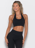front profile view of a model looking to the left wearing the Rib Backless Bra in black color