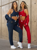 front profile view of models in outdoors wearing the Cloud Comfort Joggers in scarlet red and sapphire blue color