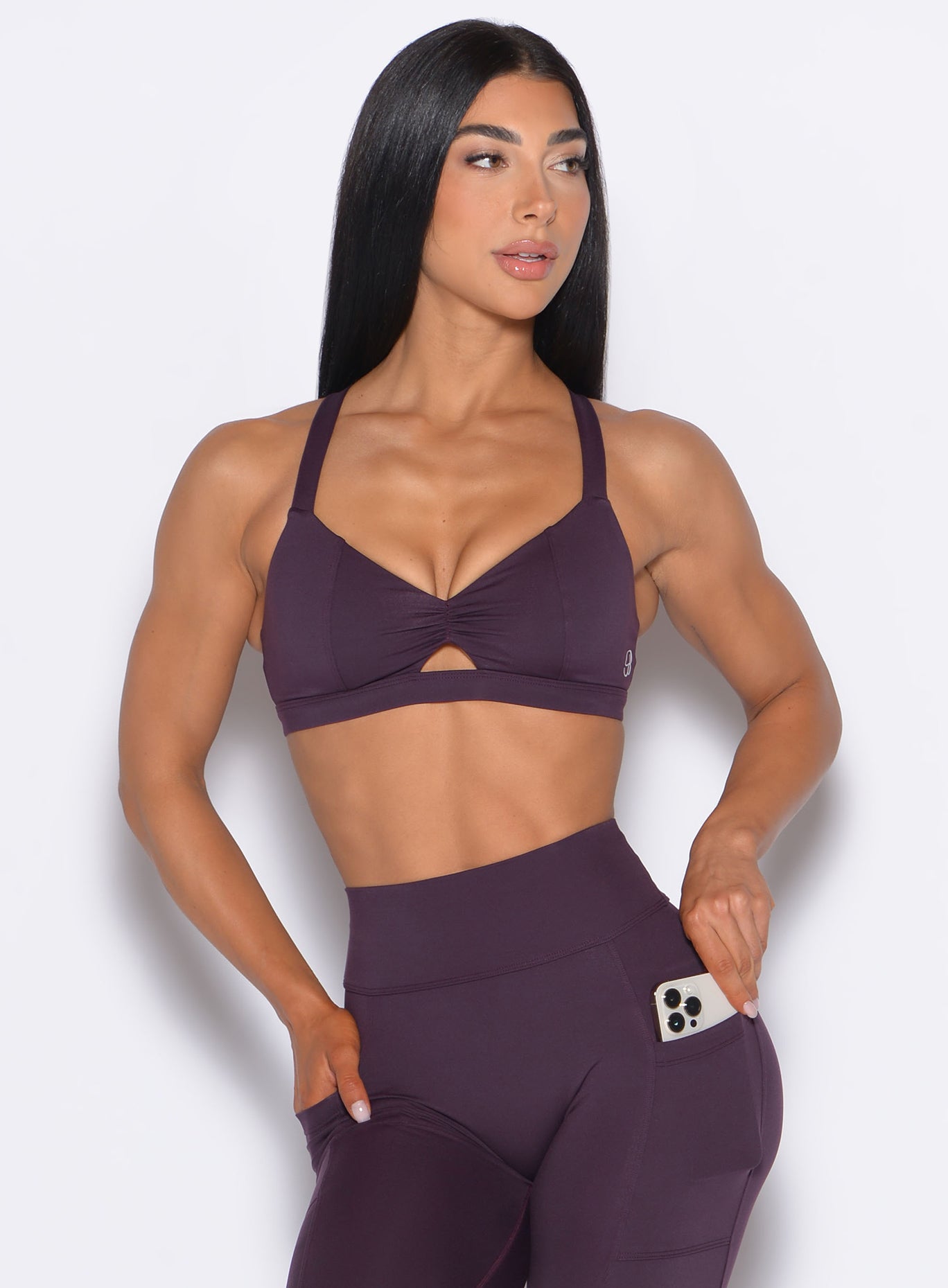 Plum Noir Sweetheart Sports Bra with a scrunched center and front keyhole for a sculpted gym look.