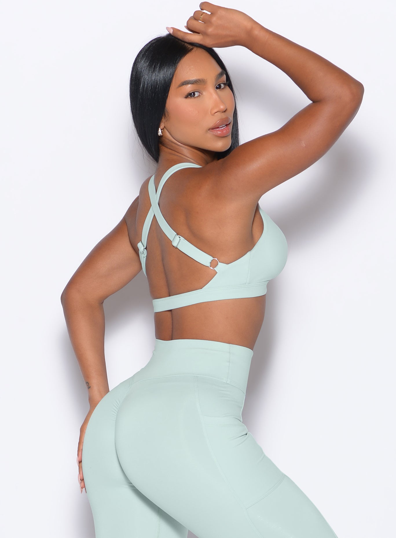 Flattering Mist Sweetheart Sports Bra side profile; adjustable racerback for peak gym performance.