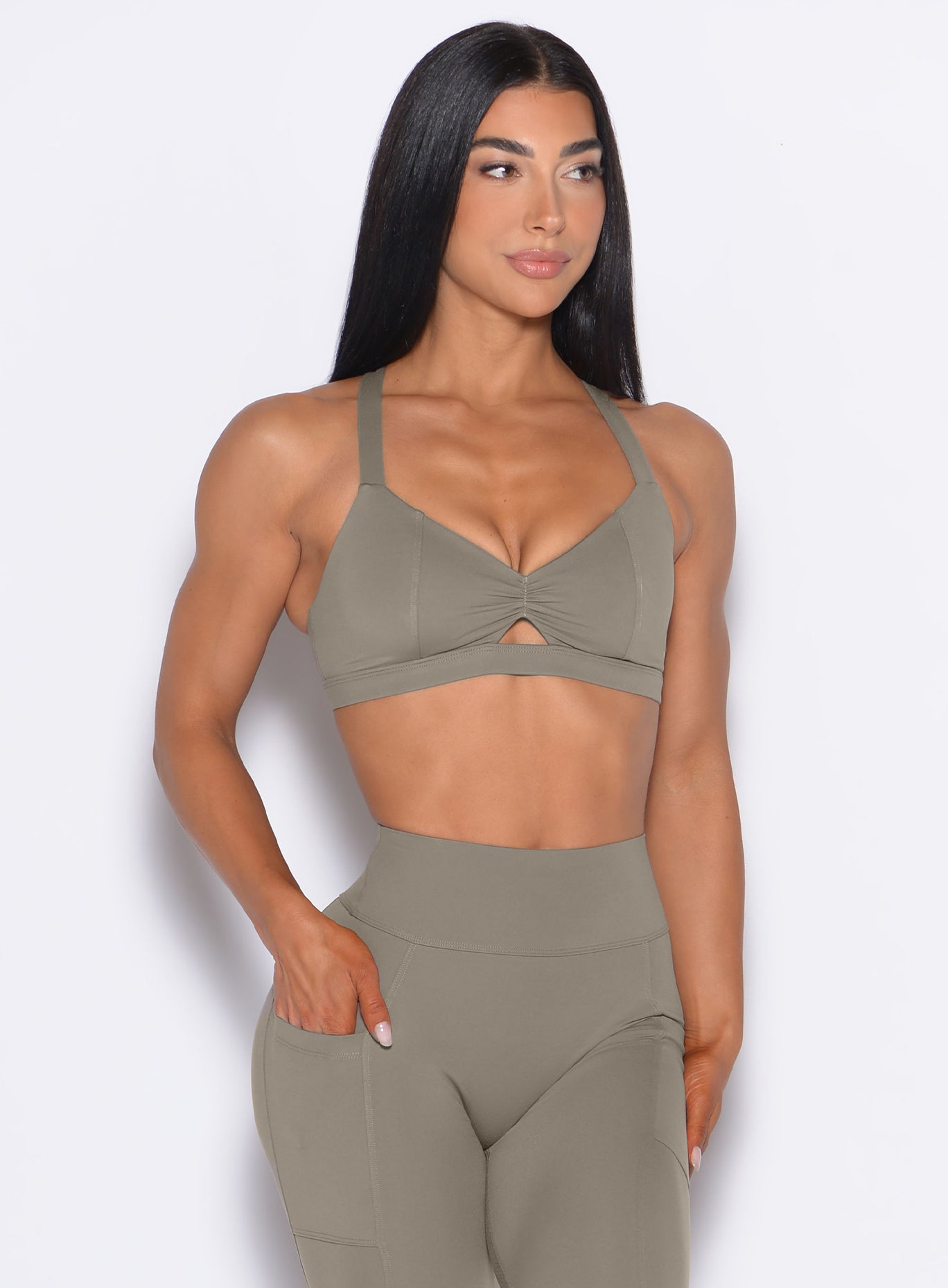 Stone Sweetheart Sports Bra with princess seams and a center scrunch for high-impact gym sessions.