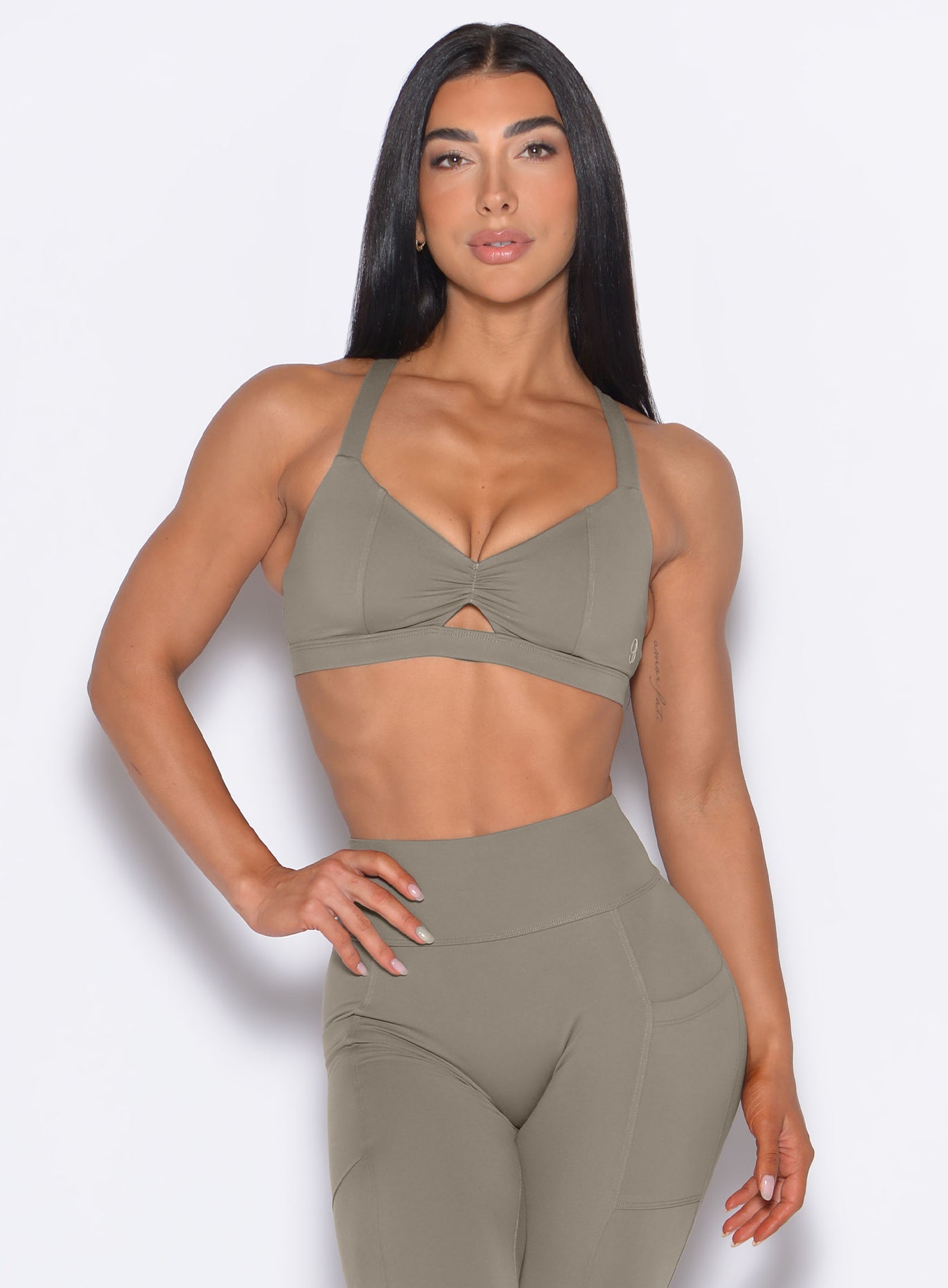 Stone Sweetheart Sports Bra featuring princess seams and a keyhole cut-out for elite gym performance.
