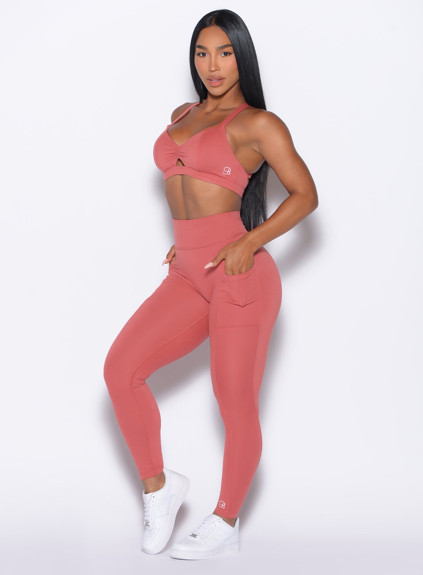 Terracotta Define Leggings: High-waist performance fit with side pockets and a sculpting bum scrunch.