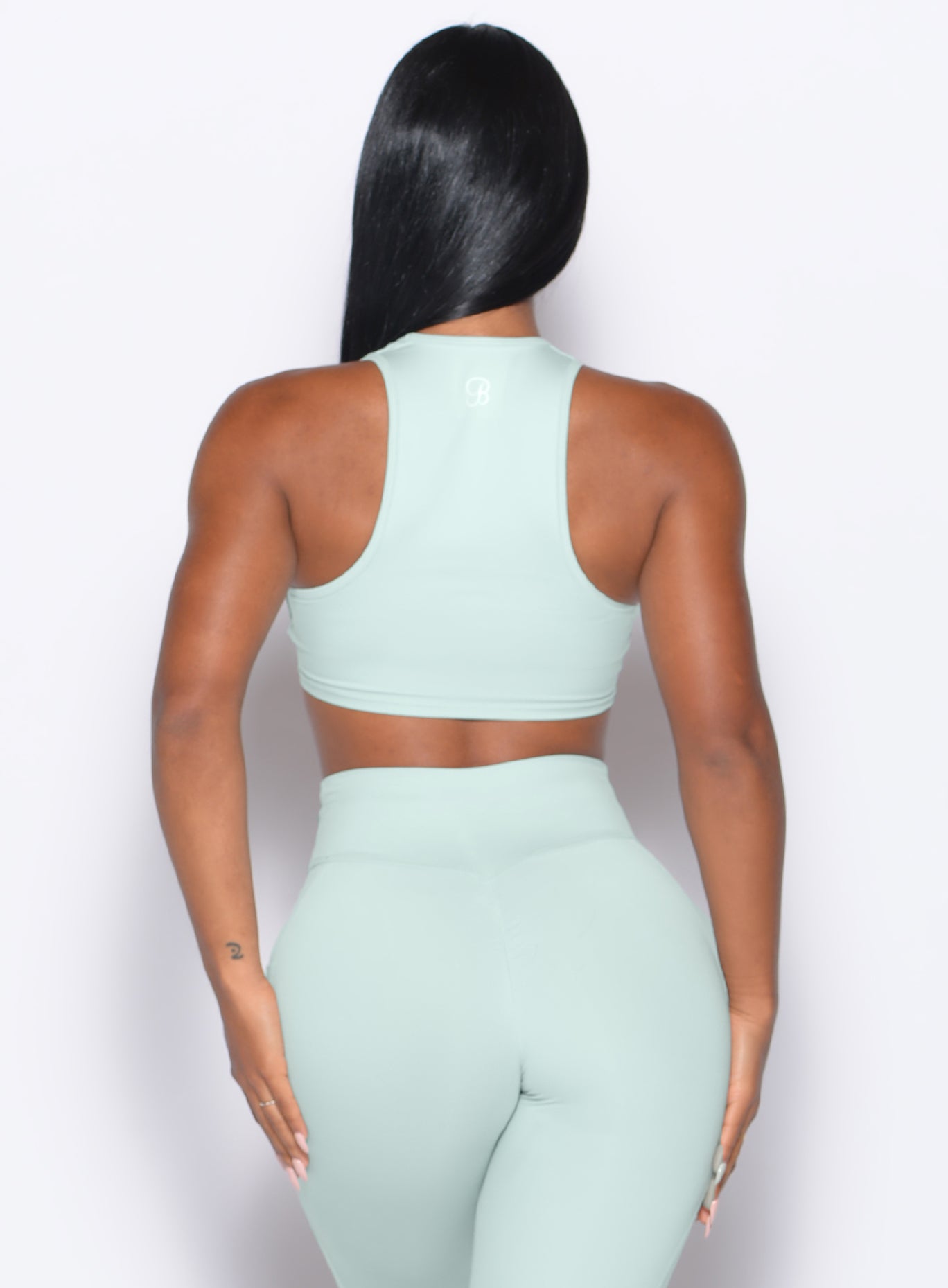 Mist Scrunch Tank Bra featuring a sleek racerback for a sculpted back view and gym-ready support.