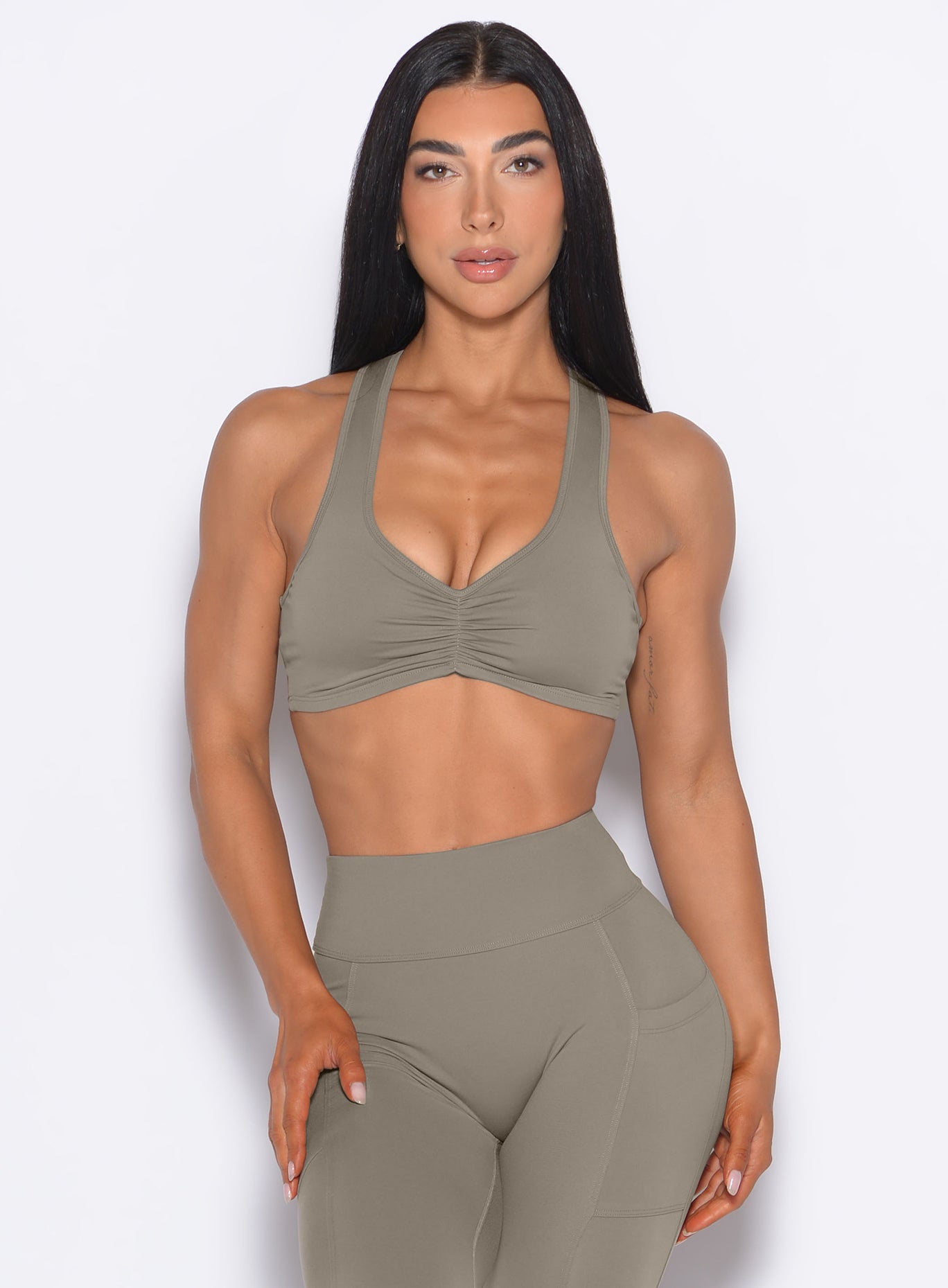 Stone Scrunch Tank Bra with a ruched front and racerback for a supportive, sculpting fitness fit.