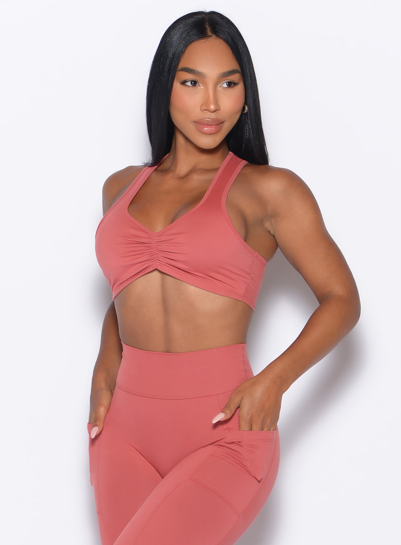 Terracotta Scrunch Tank Bra with a racerback and ruched hem detail for supportive gym sessions.