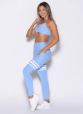left side profile view of a model wearing the Scrunch Thigh Highs in Bright Hydrangea color