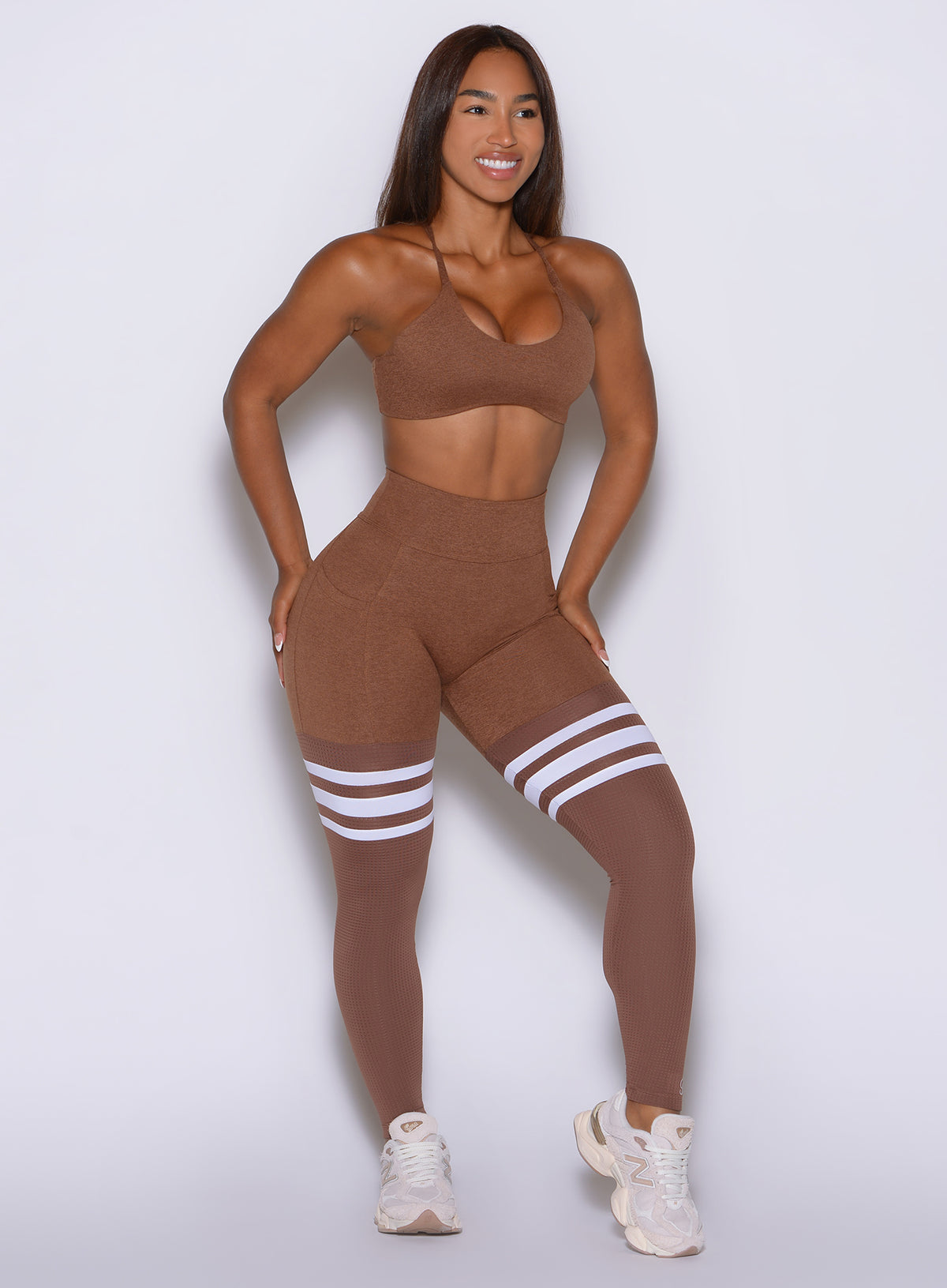Heathered performance tights featuring core-supporting high band and 4-way stretch fabric.