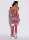 back side profile view of a model facing to the right side wearing the Scrunch Thigh Highs in Hibiscus camo color