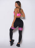 Side profile of black and neon pink Scrunch Thigh-Highs featuring mesh panels for a sculpting fit.