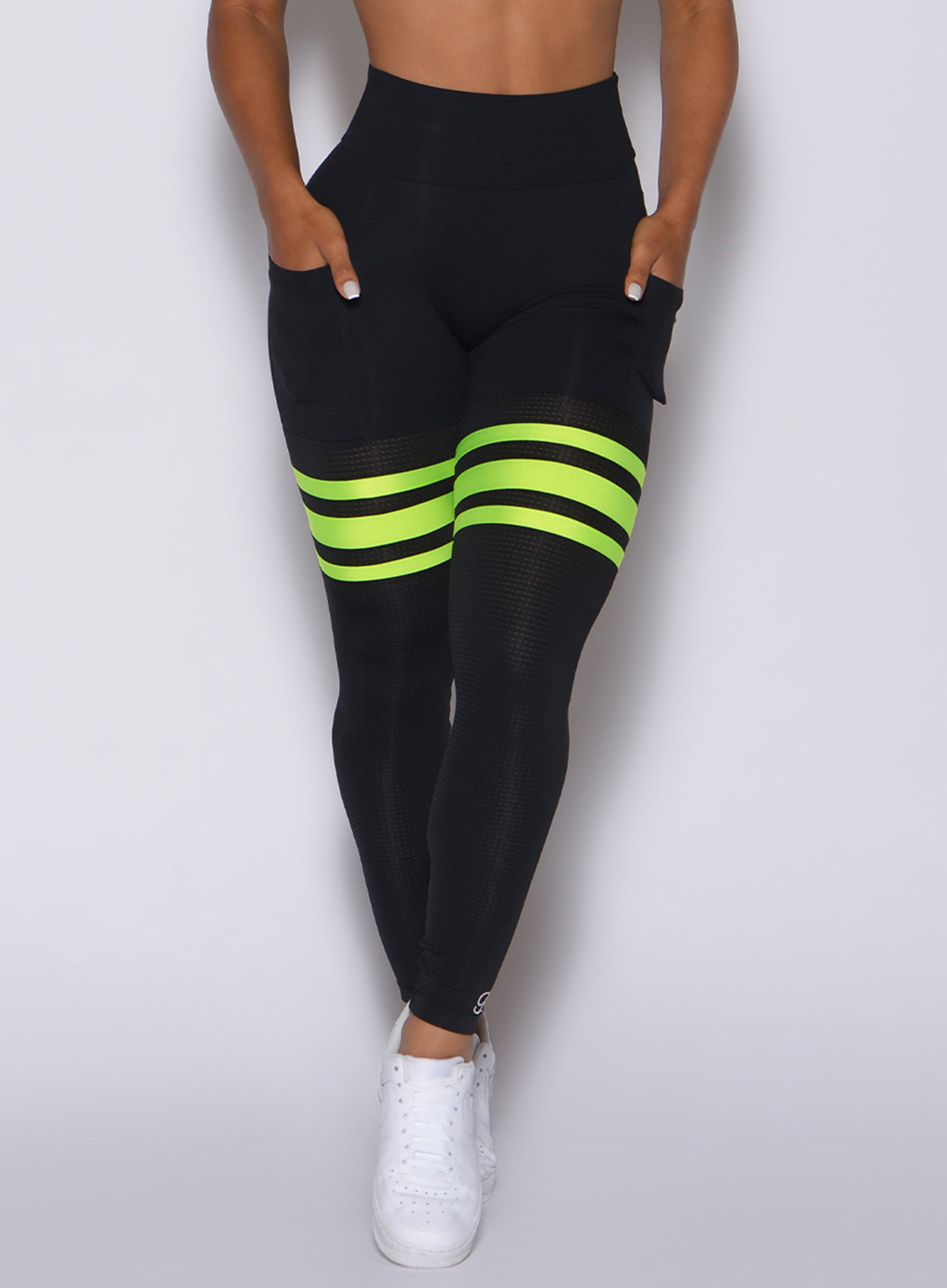 Black Scrunch Thigh-Highs with neon yellow stripes and breathable mesh for a sculpted gym look.