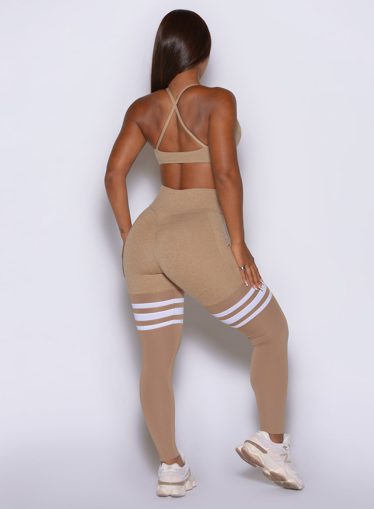 Sandstone Scrunch Thigh-Highs with patented glute-lifting seam for leg days and cardio.