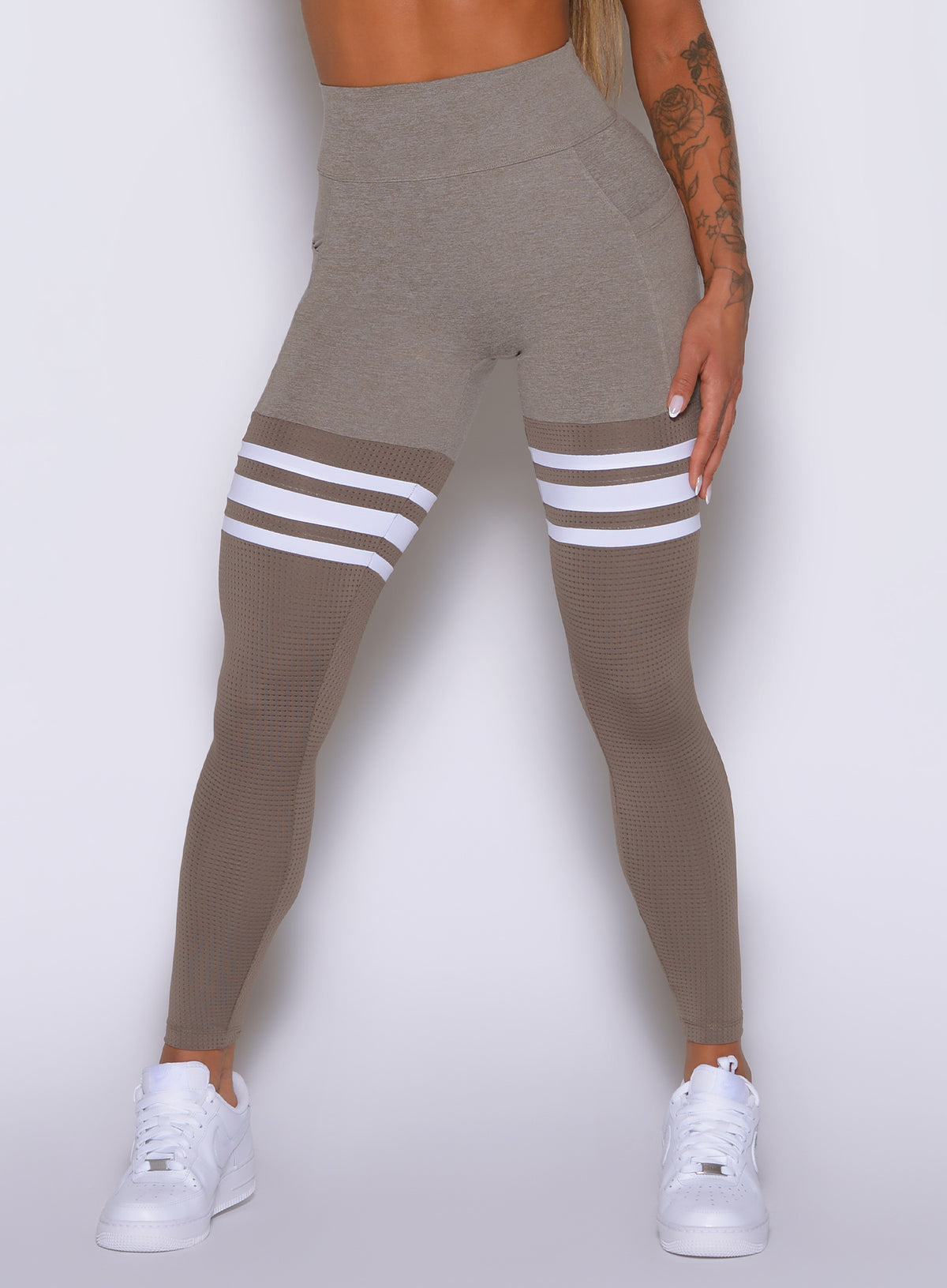 Bombshell Smoke Taupe Thigh-High leggings. High-waisted core support with dual side pockets.