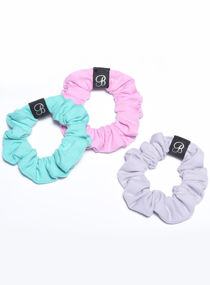 three scrunchies in different colors shot n the same frame
