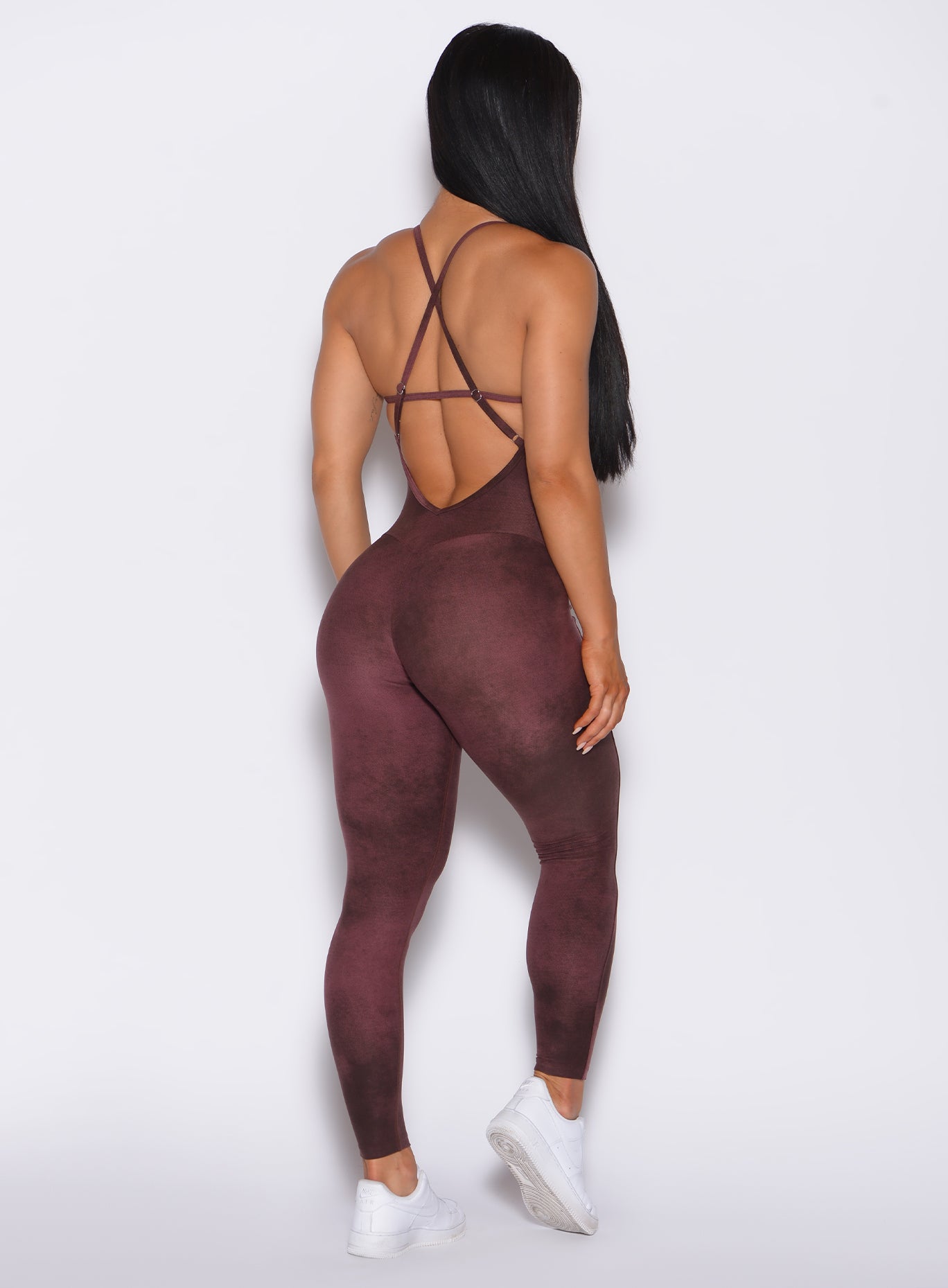 Back profile view of a model in our Sculpt Bodysuit in Vintage Port color along with the matching shape shrug