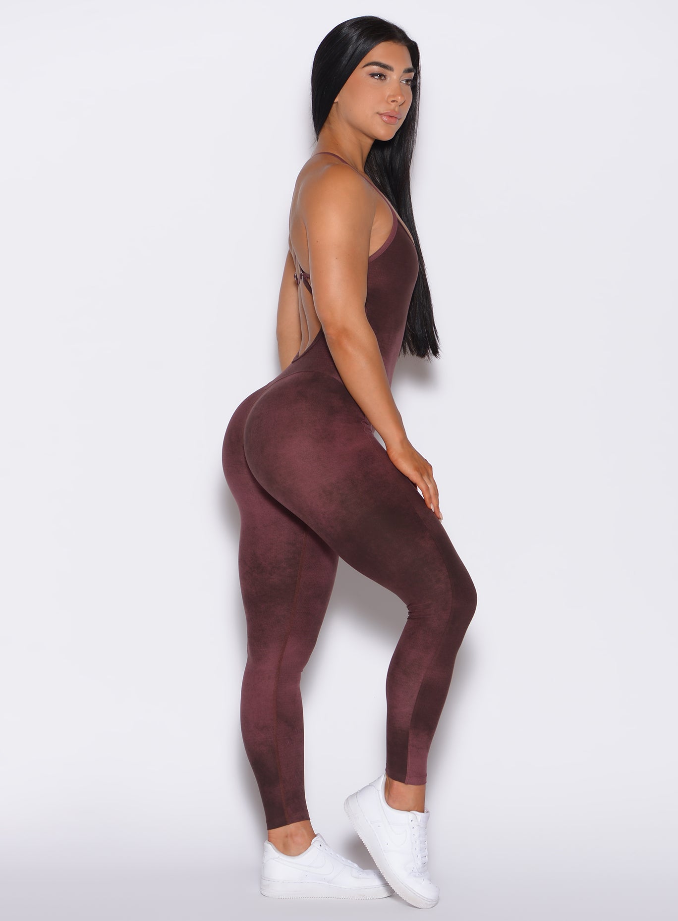 Right side profile view of a model in our Sculpt Bodysuit in Vintage Port color along with the matching shape shrug
