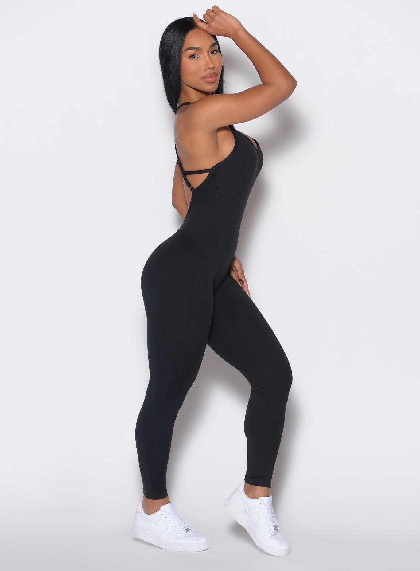 Black Sculpt Bodysuit with figure-contouring seams and adjustable straps for a snatched gym look.