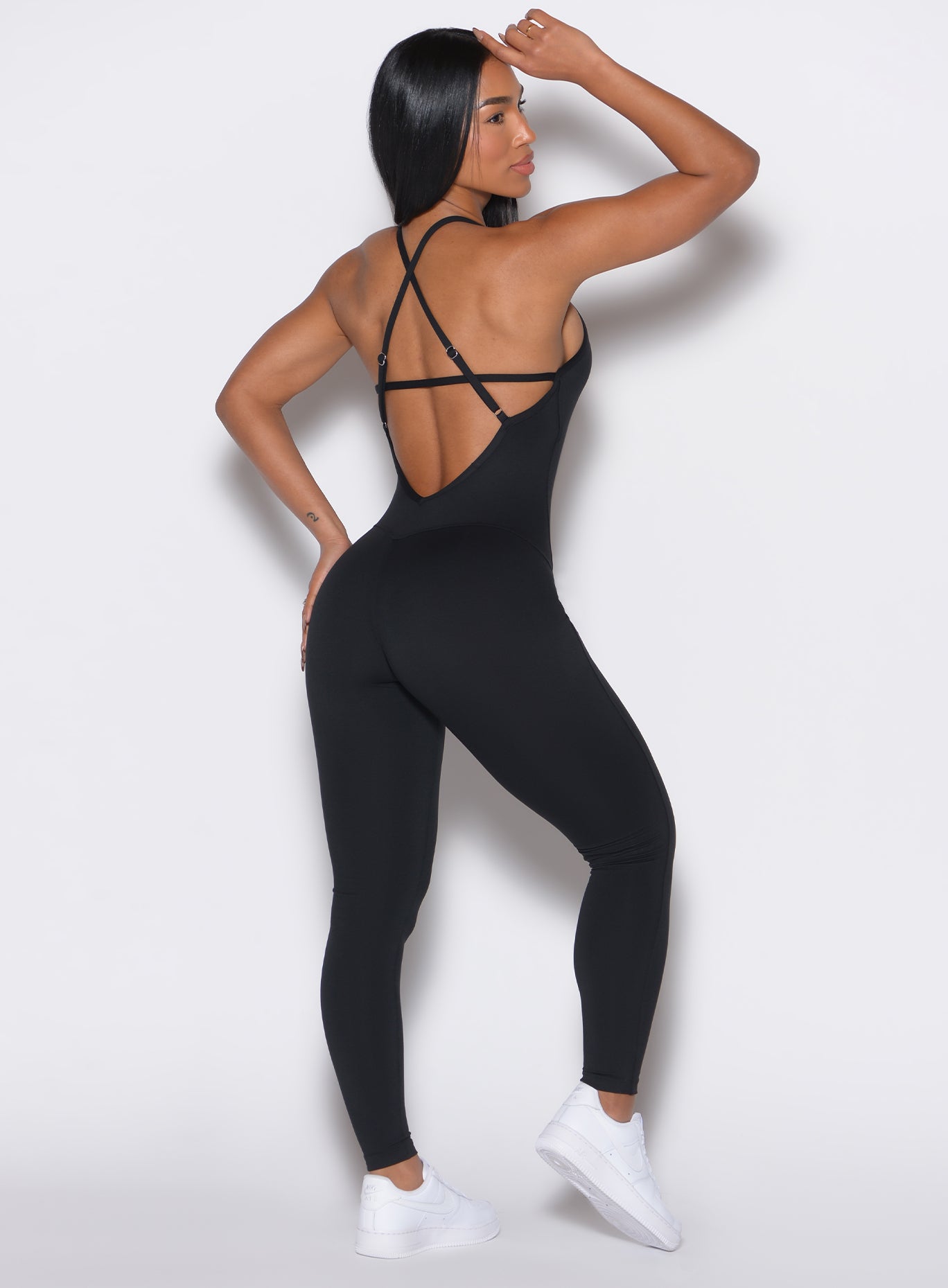 Black Sculpt Bodysuit with square neck and adjustable straps for a sleek, figure-hugging gym fit.
