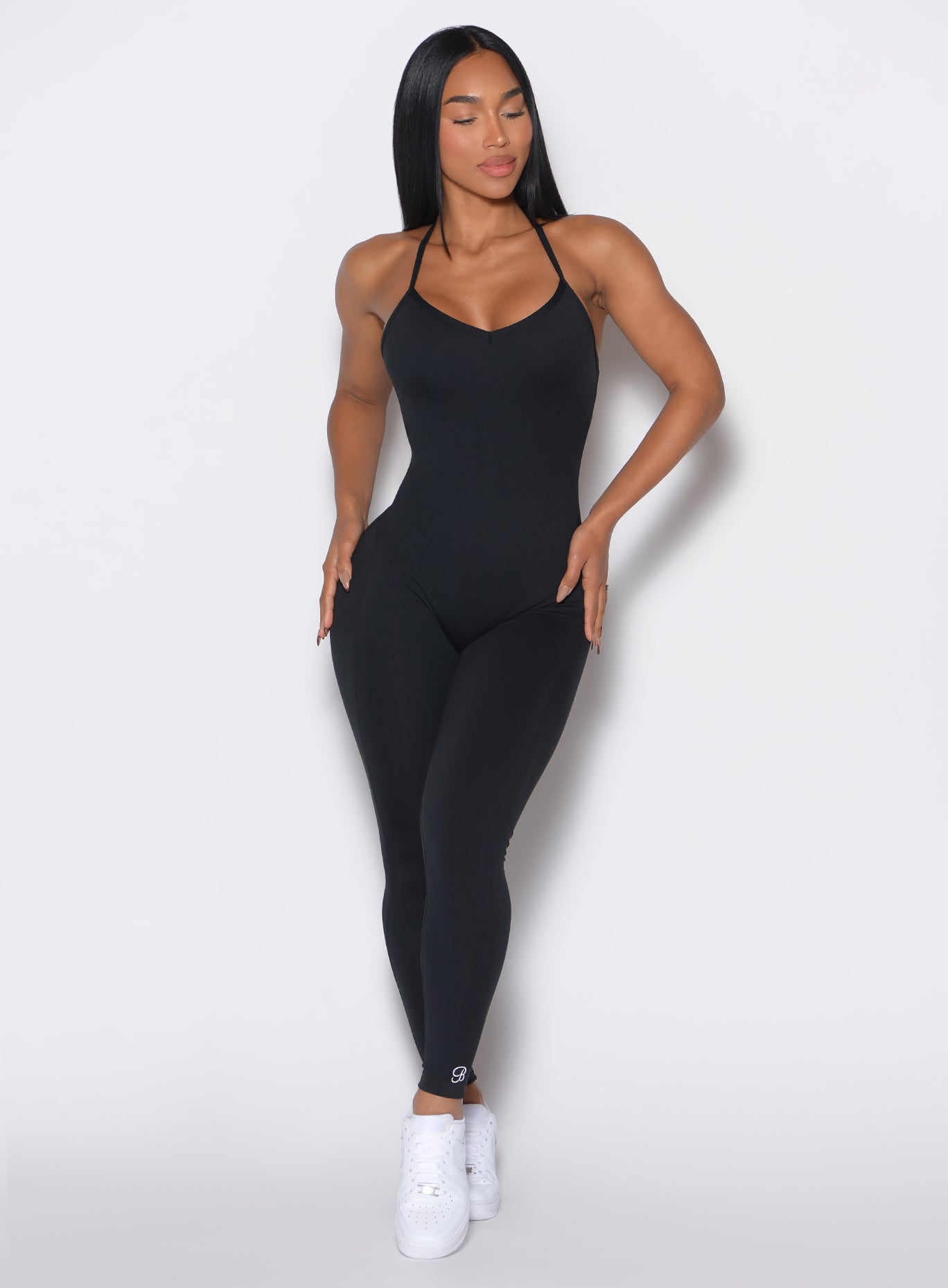 Black Sculpt Bodysuit with cross-back straps and a contouring, seamless fit for the gym.