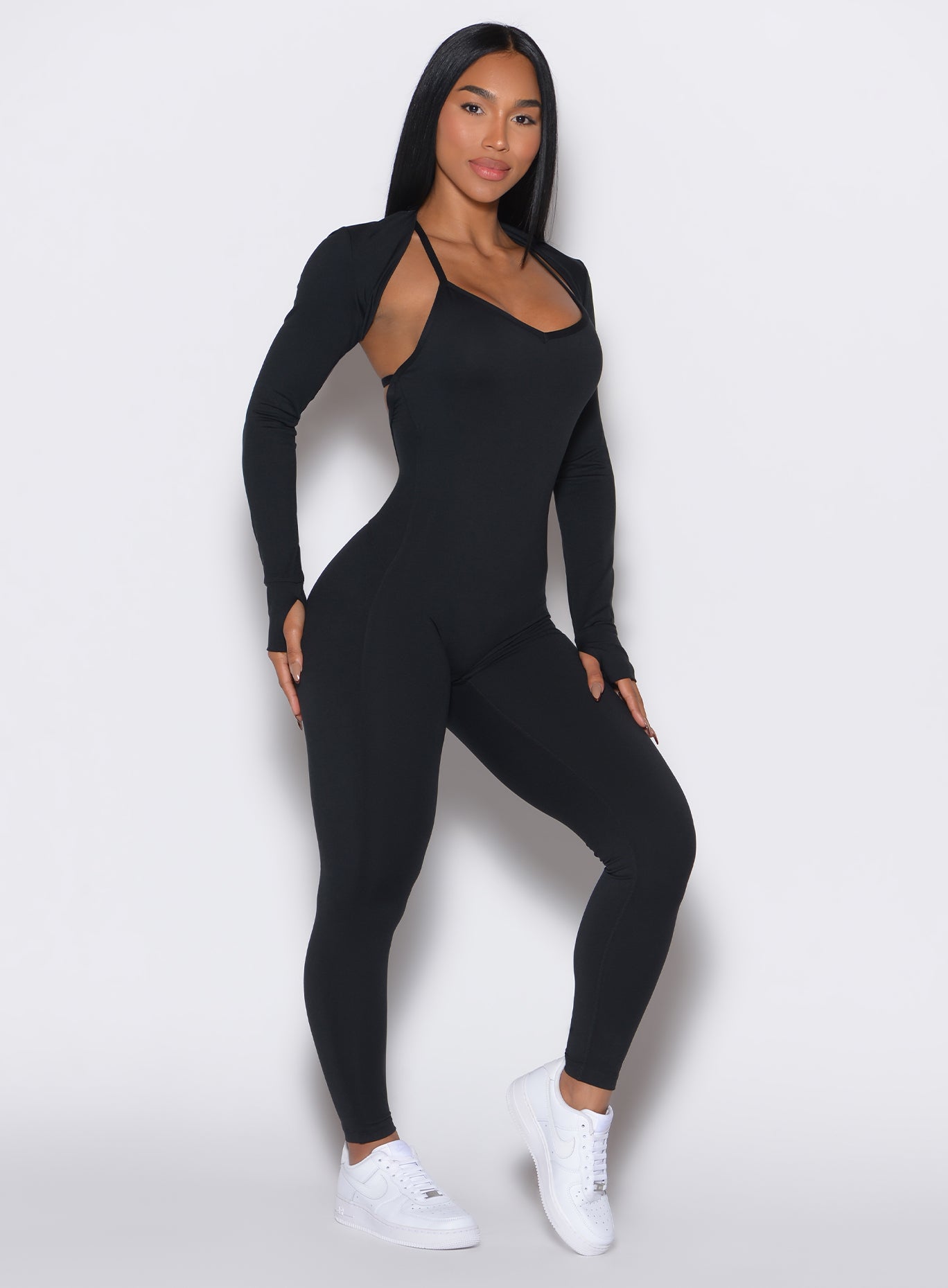 Black Shape Shrug featuring long sleeves and thumbholes for effortless gym-to-street layering.