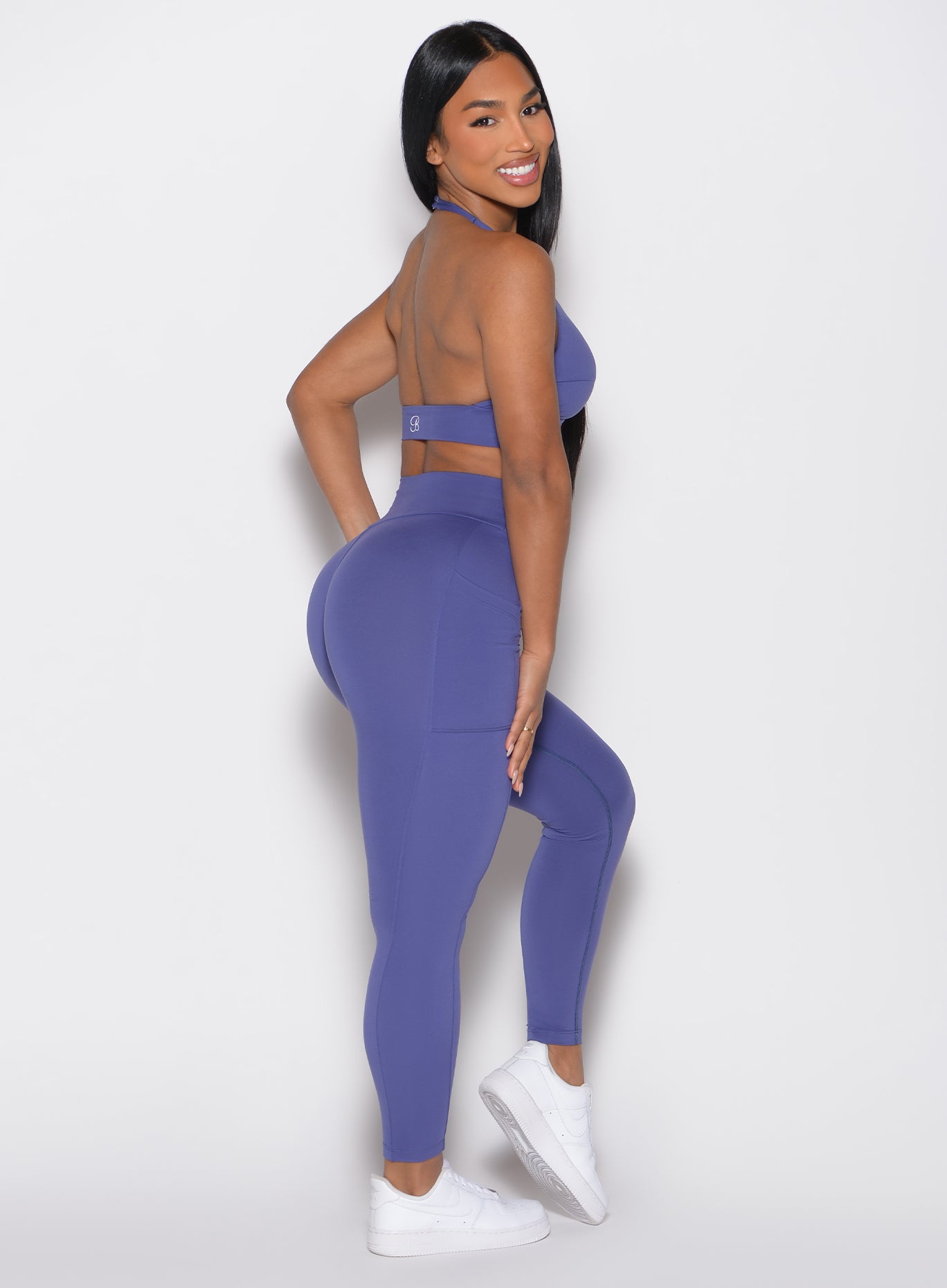 Future Dusk Sculpt Knot Leggings with high-waisted support and side pockets for a sculpted gym fit.