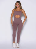 Mauve Sculptura Bodysuit with contouring seams and bold cutouts for a high-performance gym look.