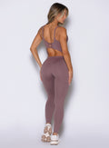 Mauve Sculptura Bodysuit with a stylish lace-up back and sculpting seams for high-impact training.