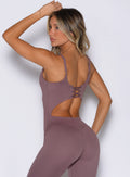 Mauve Sculptura Bodysuit with an edgy lace-up back and sculpting seams for a high-performance fit.