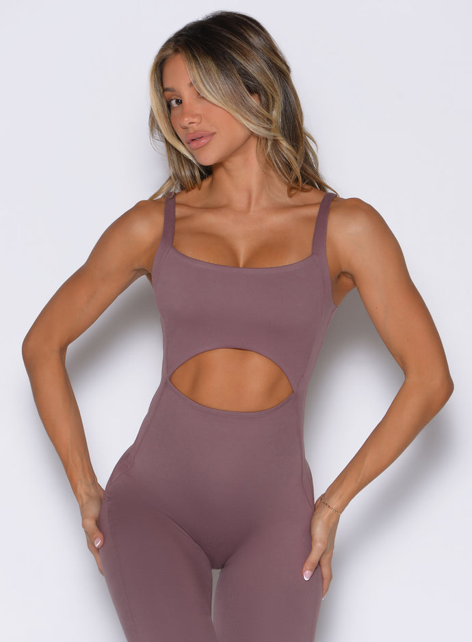 Mauve Sculptura Bodysuit featuring front cutouts and curve-defining seams for an elite gym look.