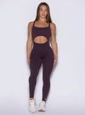 front view of a model wearing the Sculptura Bodysuit in plum noir color