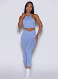 front profile view of a model wearing our Contour Seamless Leggings and the matching Lifter Heather Seamless Bra in Sky color