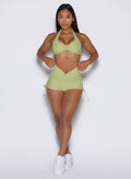 front view of a model wearing the Charm Fit shorts in serpentine color