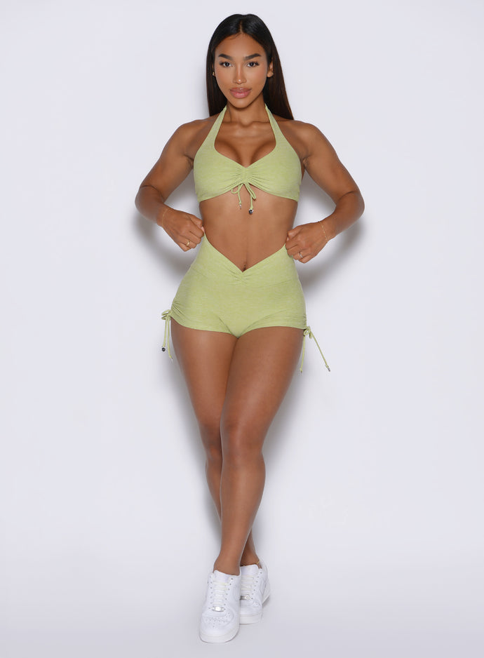 front view of a model wearing the Charm Fit shorts in serpentine color