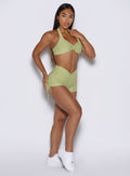 front right side view of a model wearing the Charm Fit shorts in serpentine color