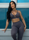 Front profile view of a model looking to her right side wearing our new shape leggings and a matching sports bra
