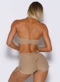 back profile view of a model wearing the Dual Charm Bra in sandstone color