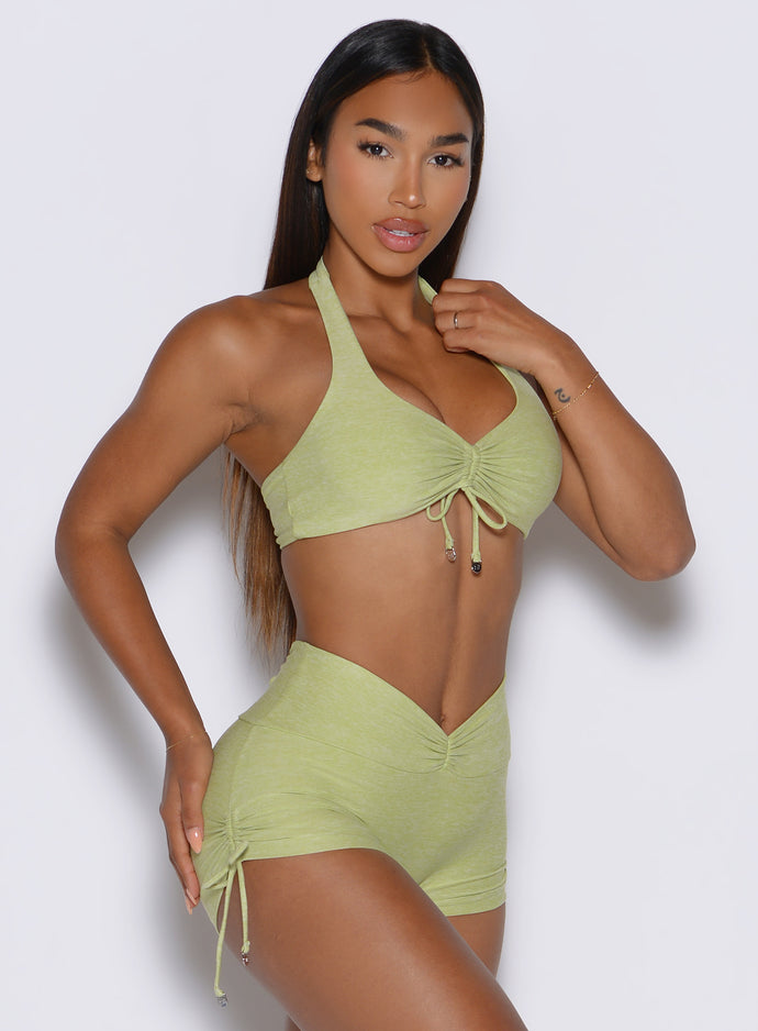 front right side profile view of a model wearing the Dual Charm Bra in serpentine color
