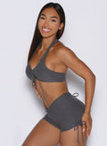 left side profile view of a model wearing the Dual Charm Bra in steel shadow color