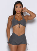 model captured from the front wearing the Dual Charm Bra in steel shadow color