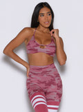 front profile view of a model looking to the left side wearing the She owns it Bra in hibiscus camo