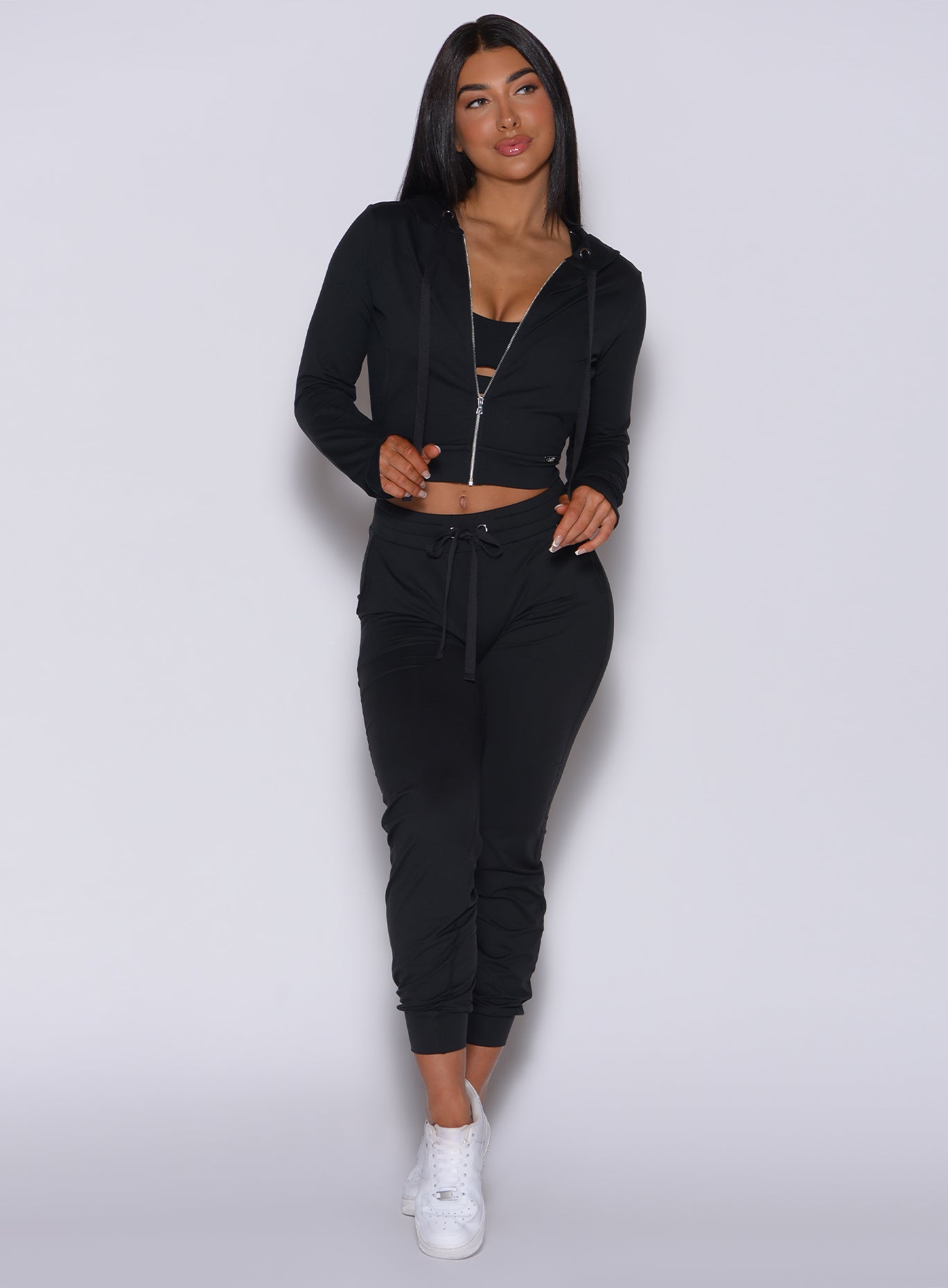 Chic black Signature Jacket and high-waist Cozy Joggers; a sculpting, two-piece lounge set.