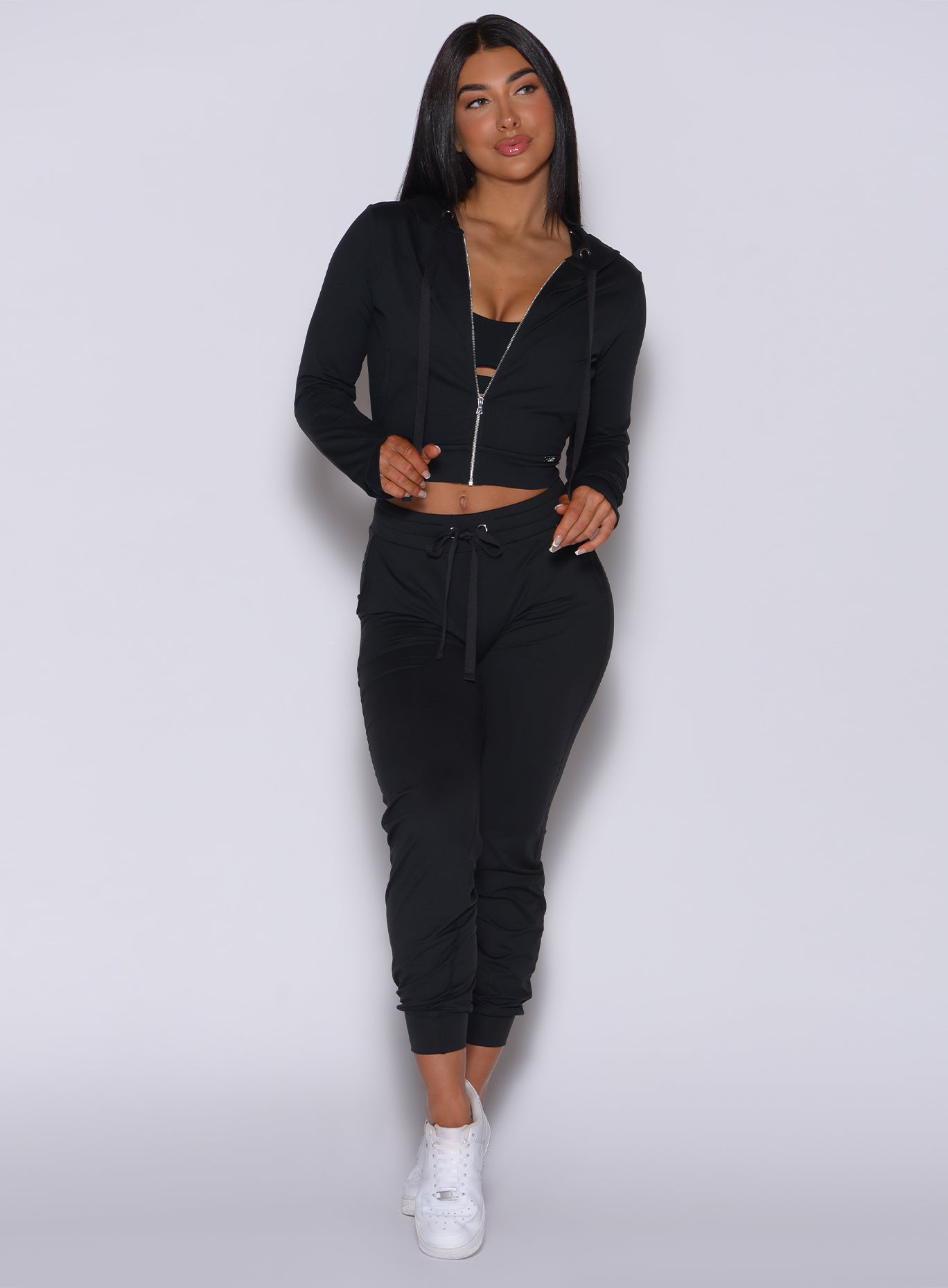front view of model wearing an all two piece black lounge set