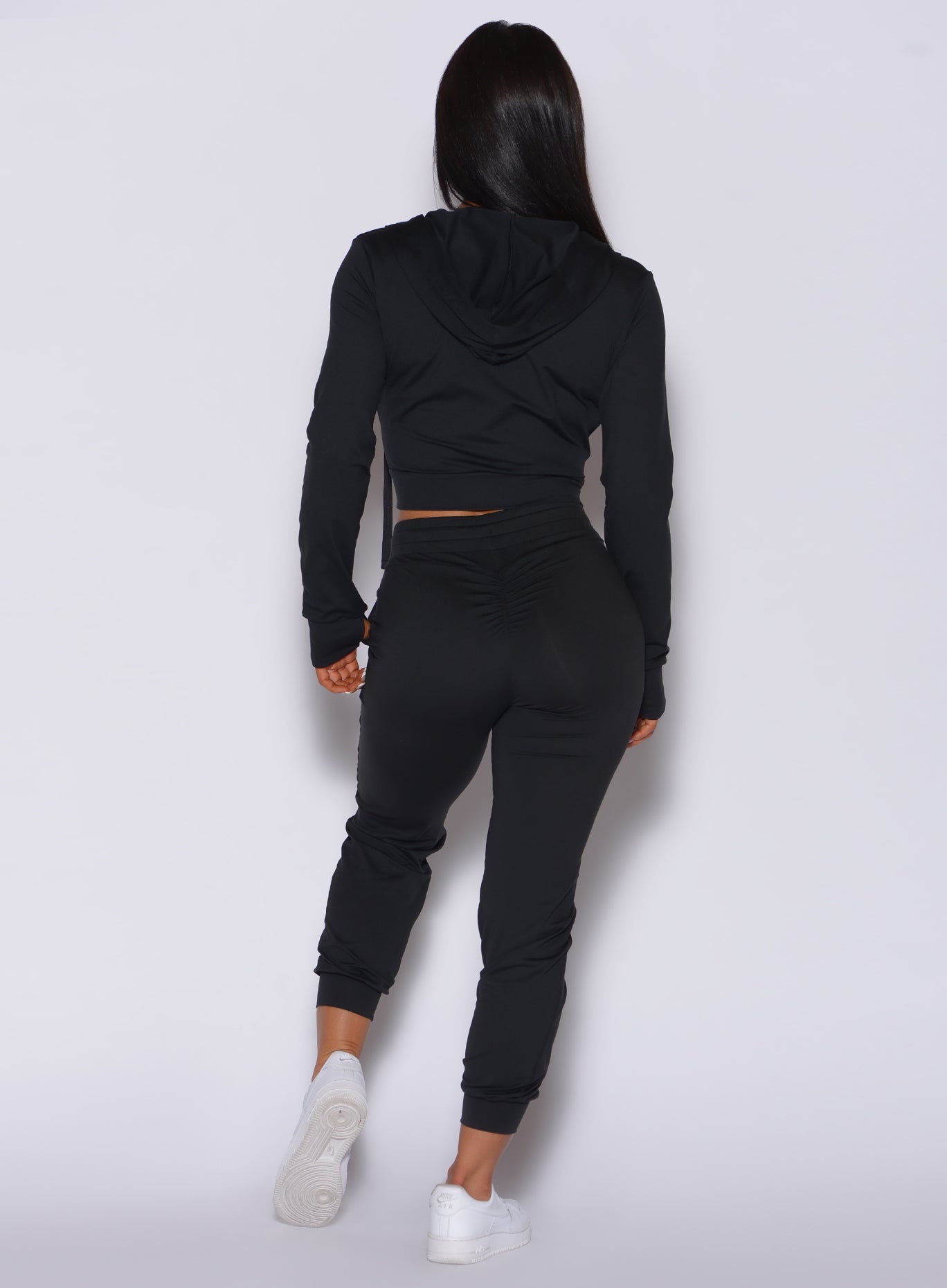 back view of model wearing the cozy black joggers with pockets and scrunch butt