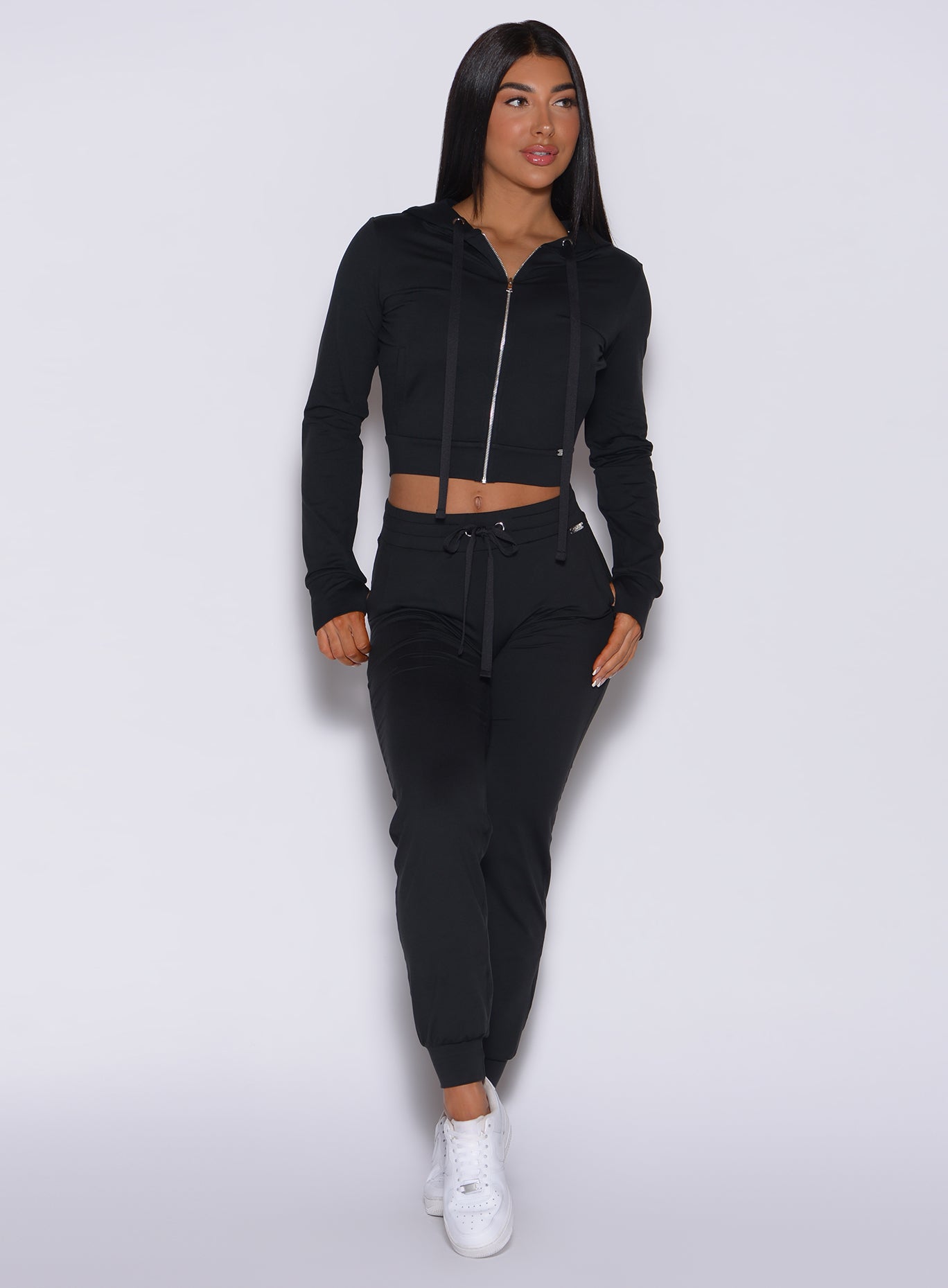 Black Signature Jacket with thumbholes and contour seams; a high-performance sculpting gym layer.