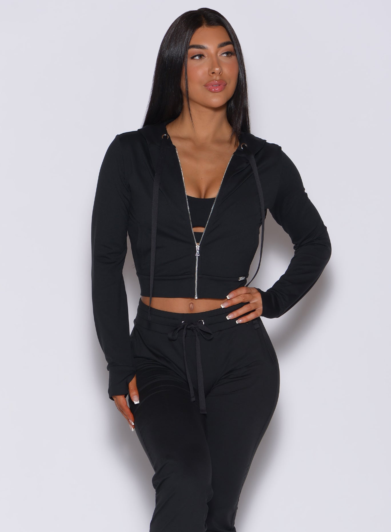 Black Signature Jacket with a cinched waist and lightweight fit for post-workout style.