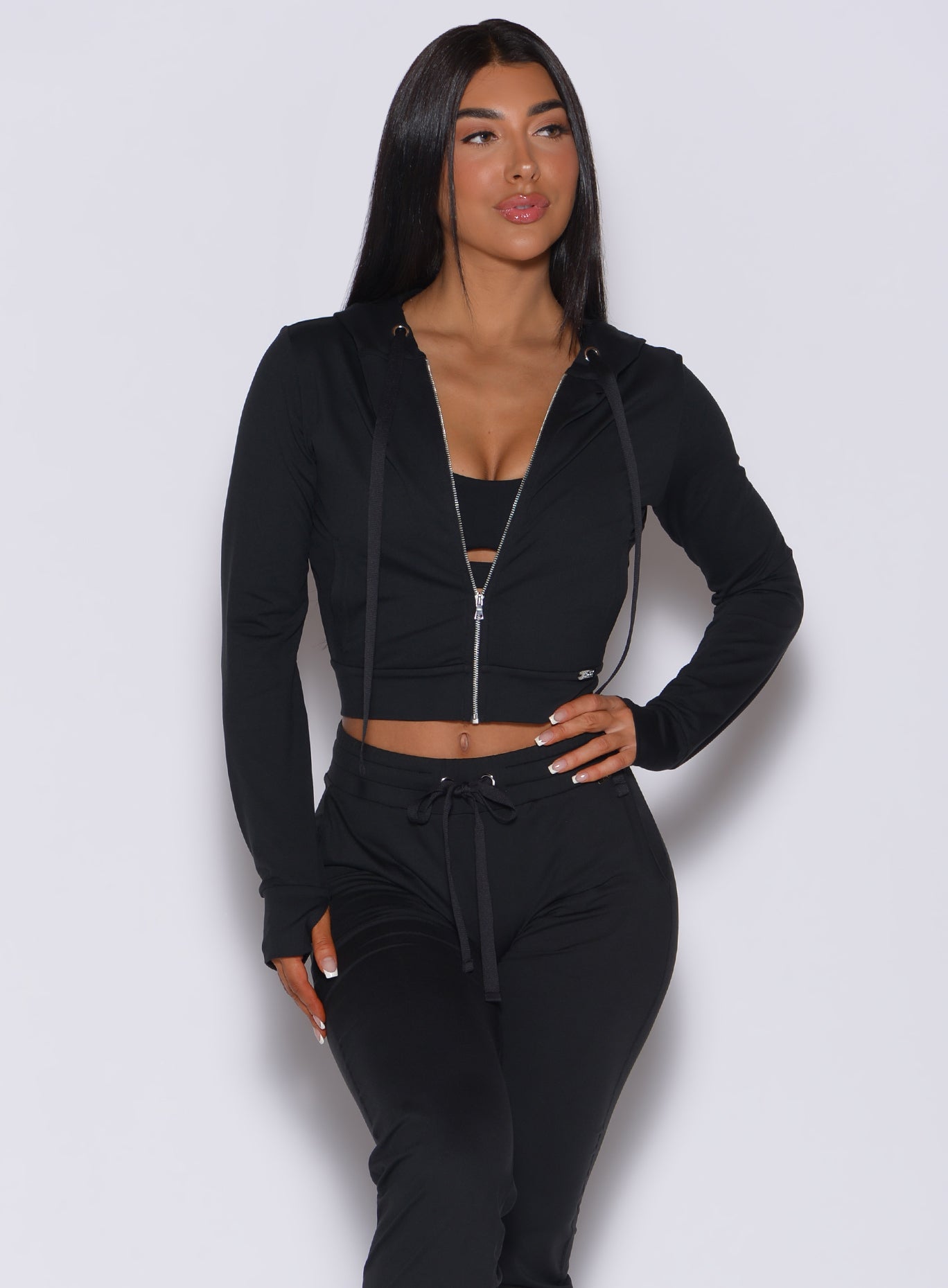 front view of model in zip front signature jacket and matching cozy black joggers