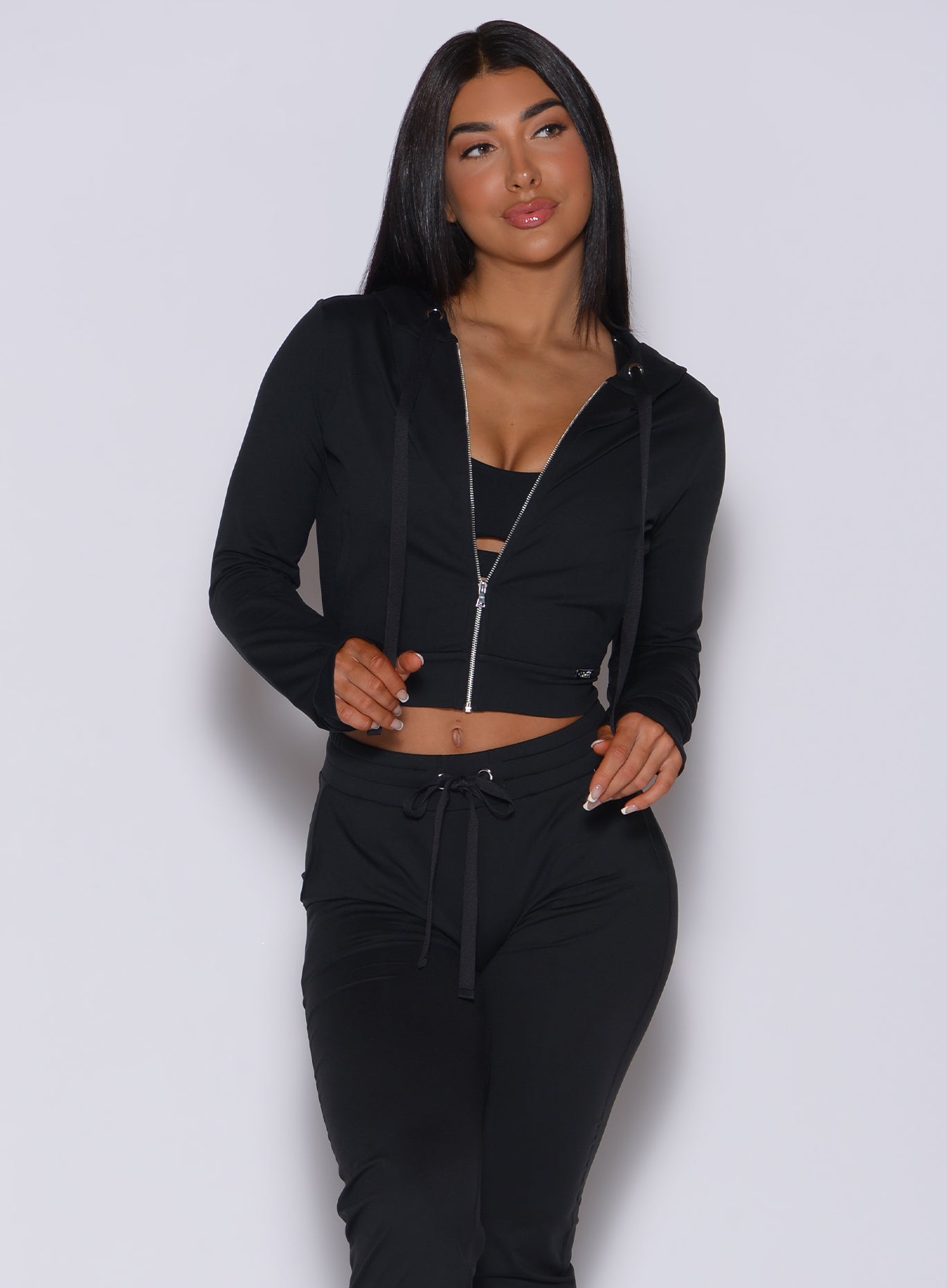 Black Signature Jacket paired with scrunch joggers for a sculpted, cohesive gym look.