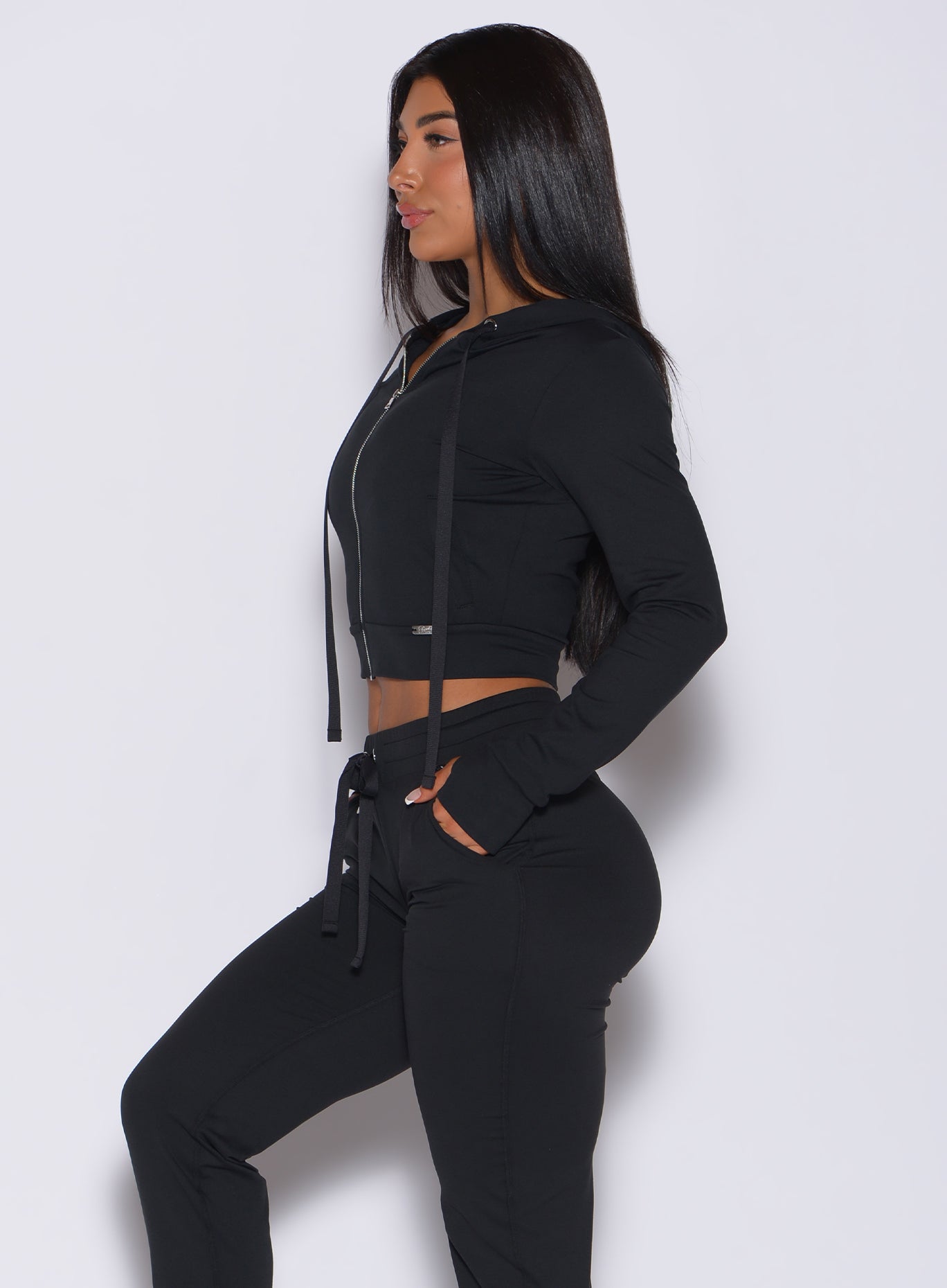 side view of model in a cute solid balck jogger lounge set