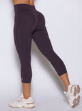 Close-up of the back-left Black Orchid Smooth capri, highlighting the lifting internal scrunch